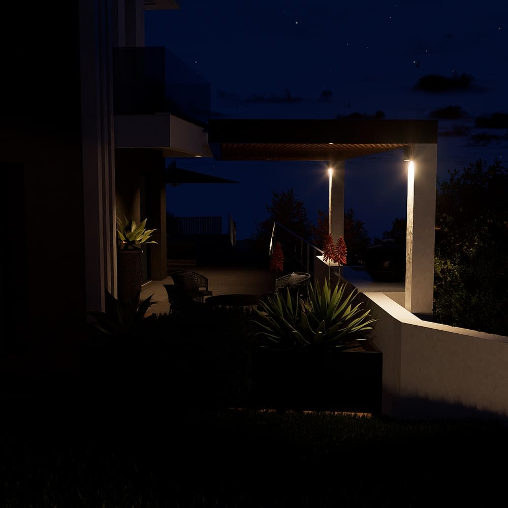 Terrasse moderne éclairée avec pergola, mobilier de jardin et aloès rouges sous un ciel nocturne étoilé.